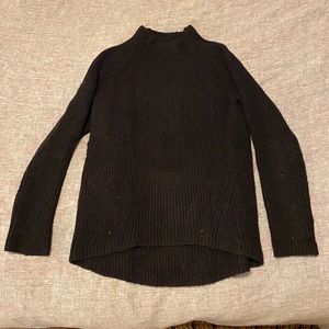 Black cable knit sweater. Super cozy! Slightly longer in back.